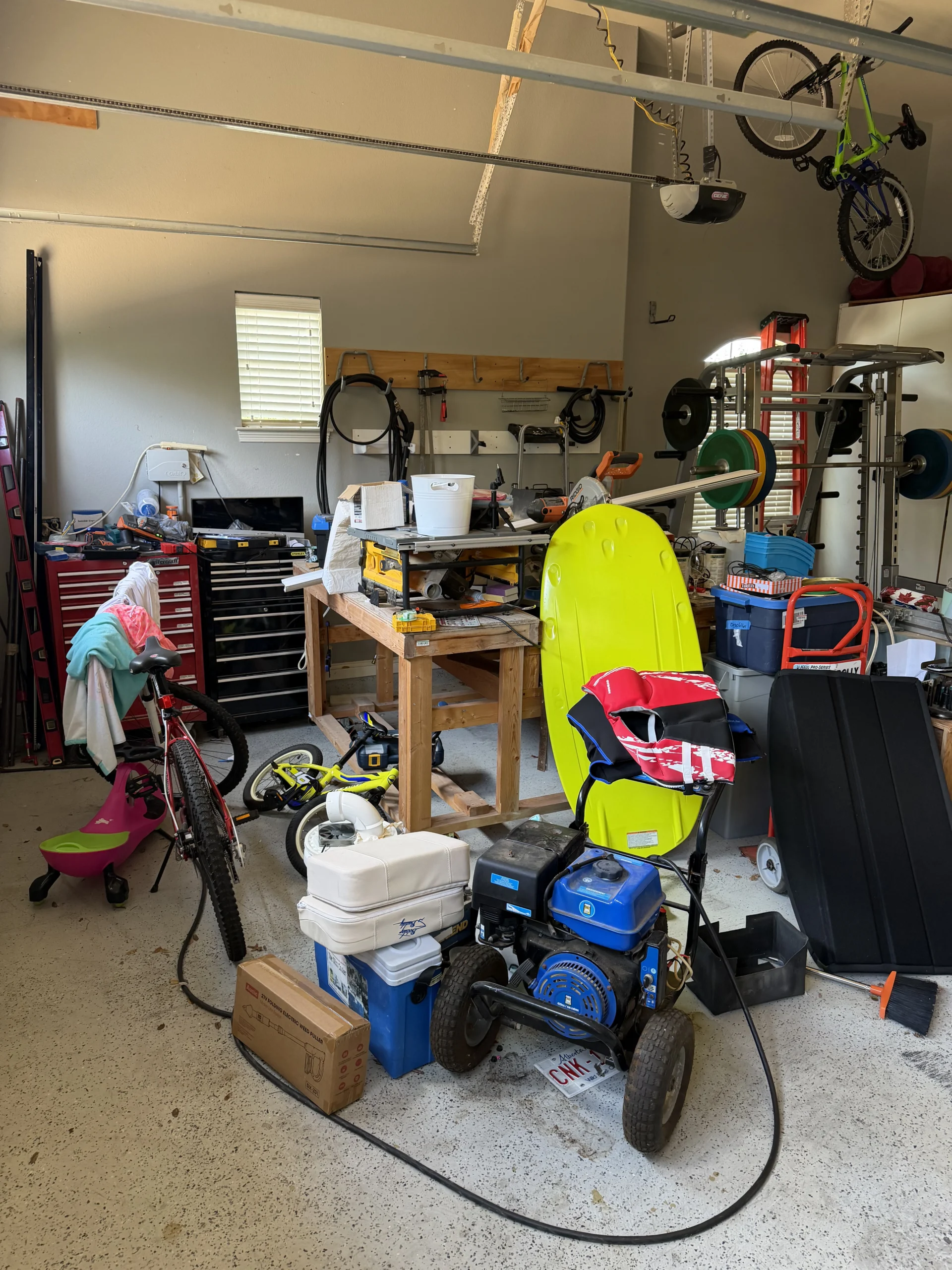 Cluttered garage before Top Tier Tidying organized it