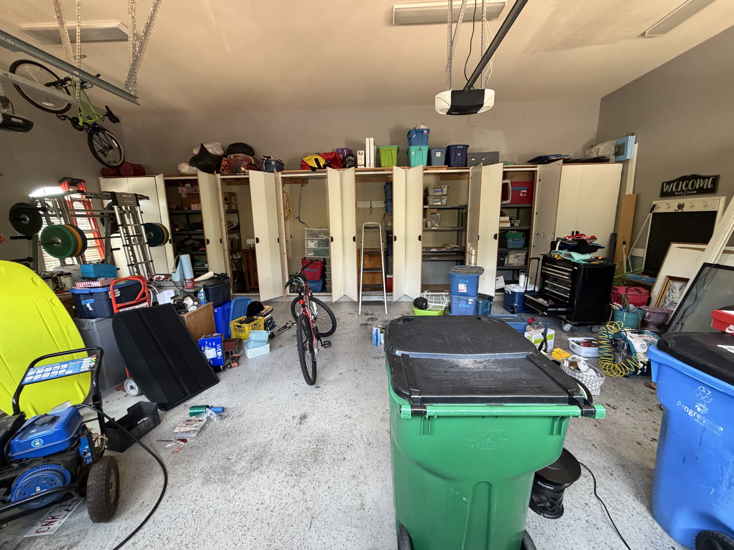 Cluttered garage before Top Tier Tidying organized it
