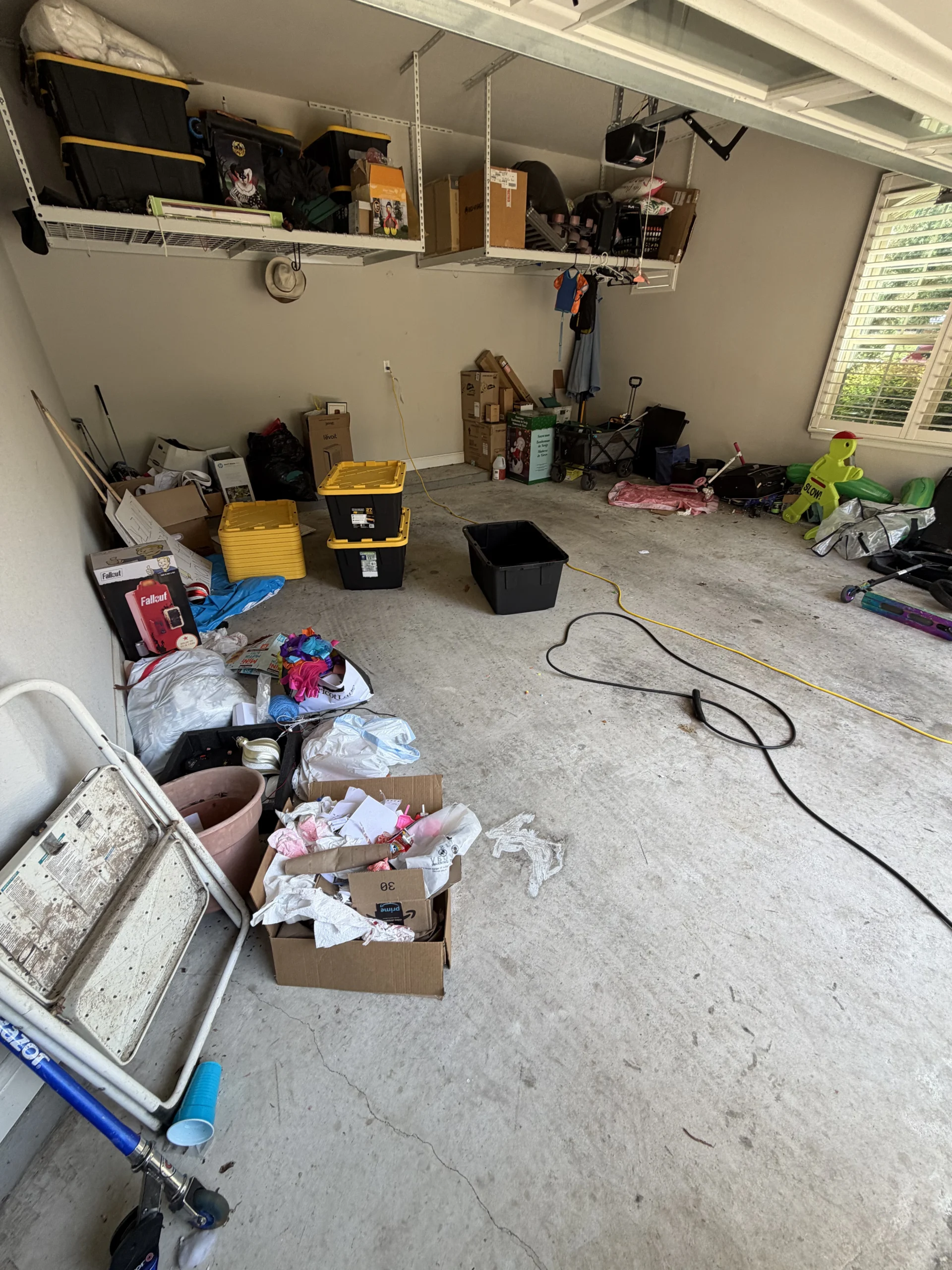 Cluttered garage before Top Tier Tidying organized it