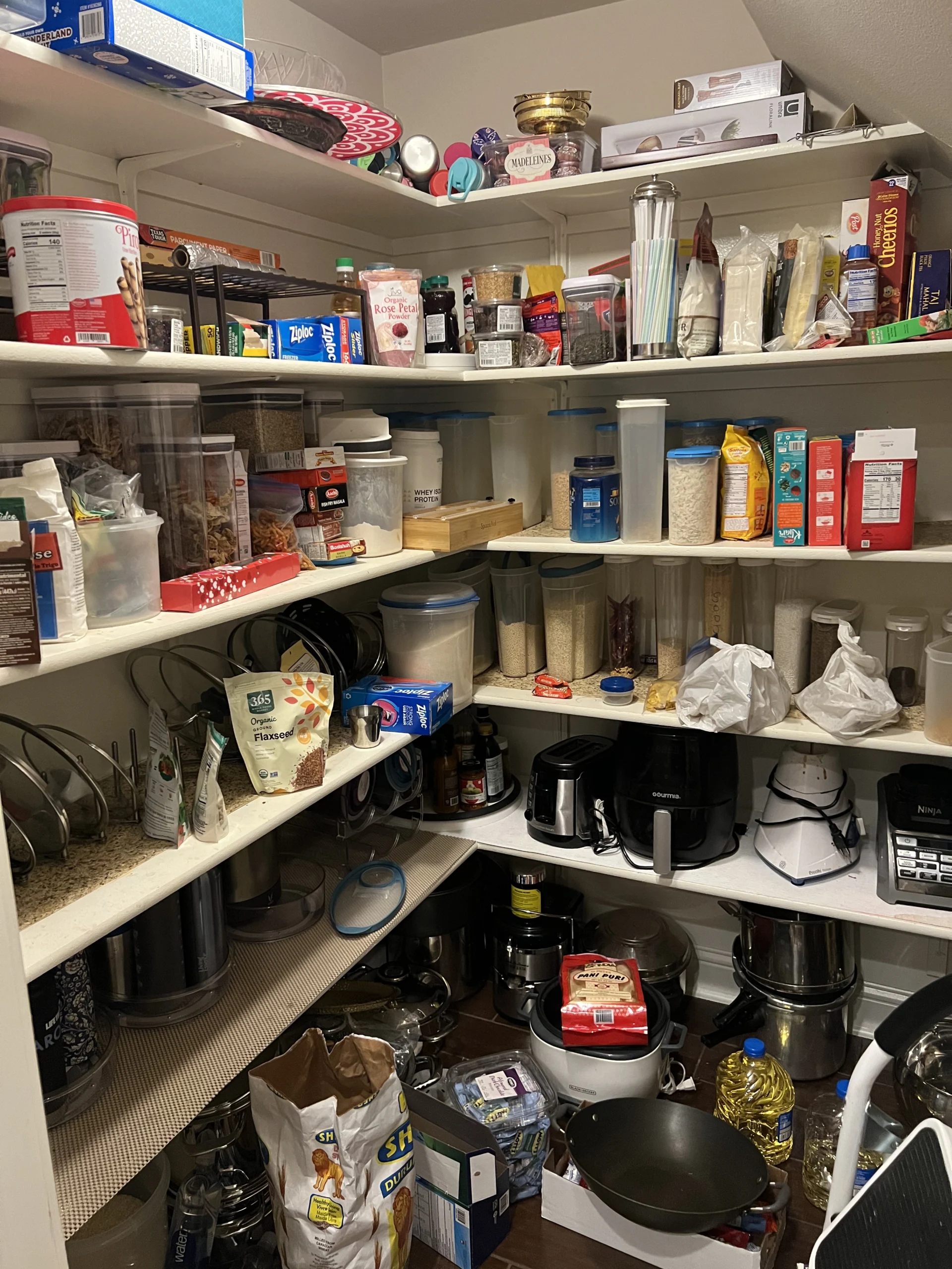 Cluttered pantry or kitchen before Top Tier Tidying organized it