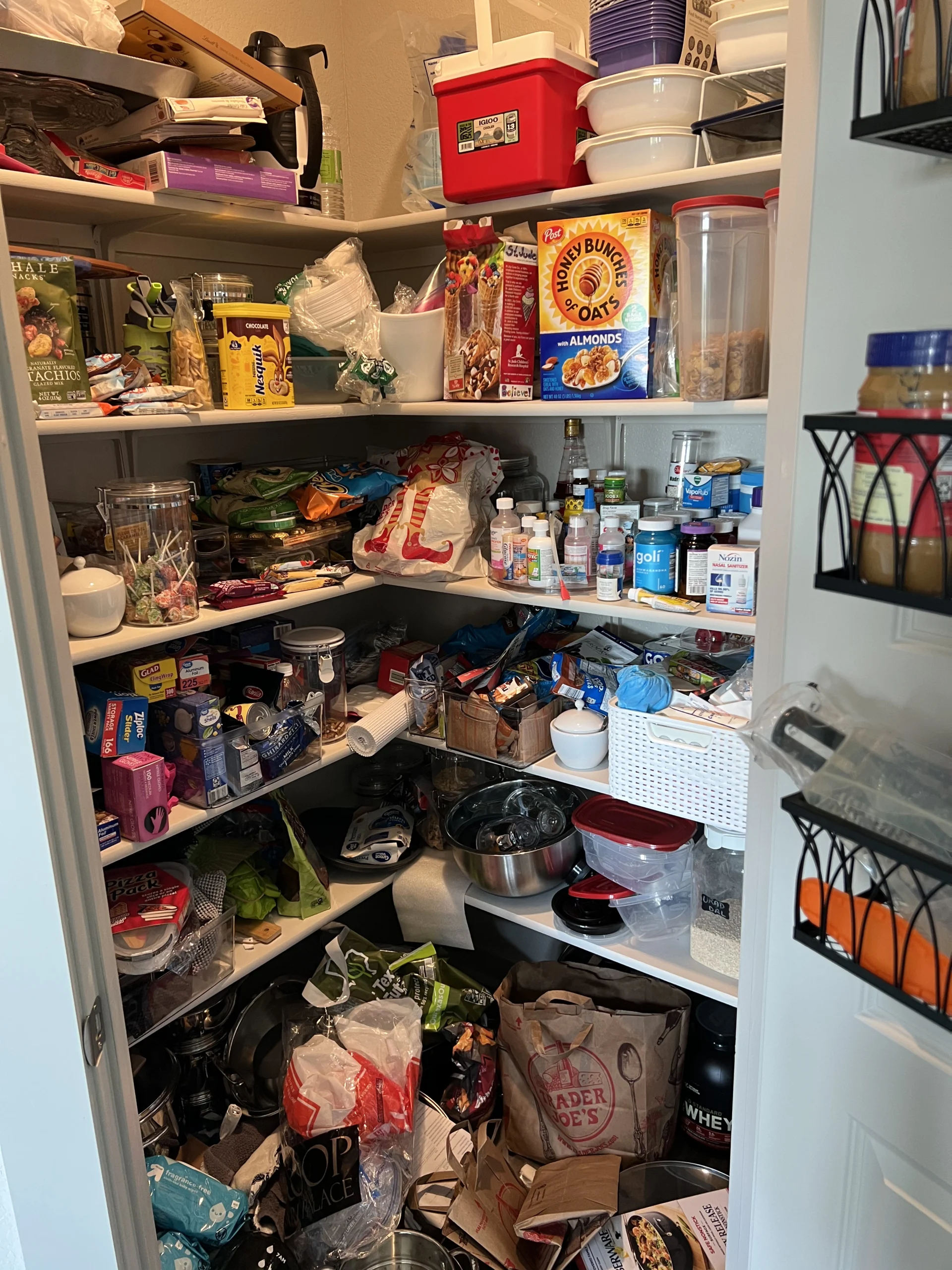 Cluttered pantry or kitchen before Top Tier Tidying organized it