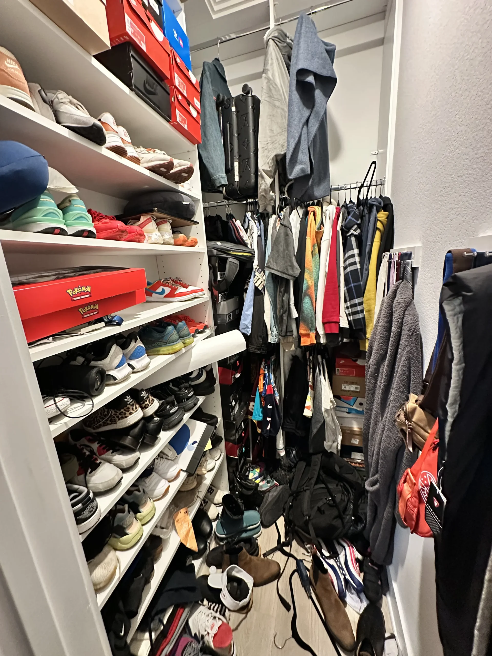 Cluttered closet before Top Tier Tidying organized it