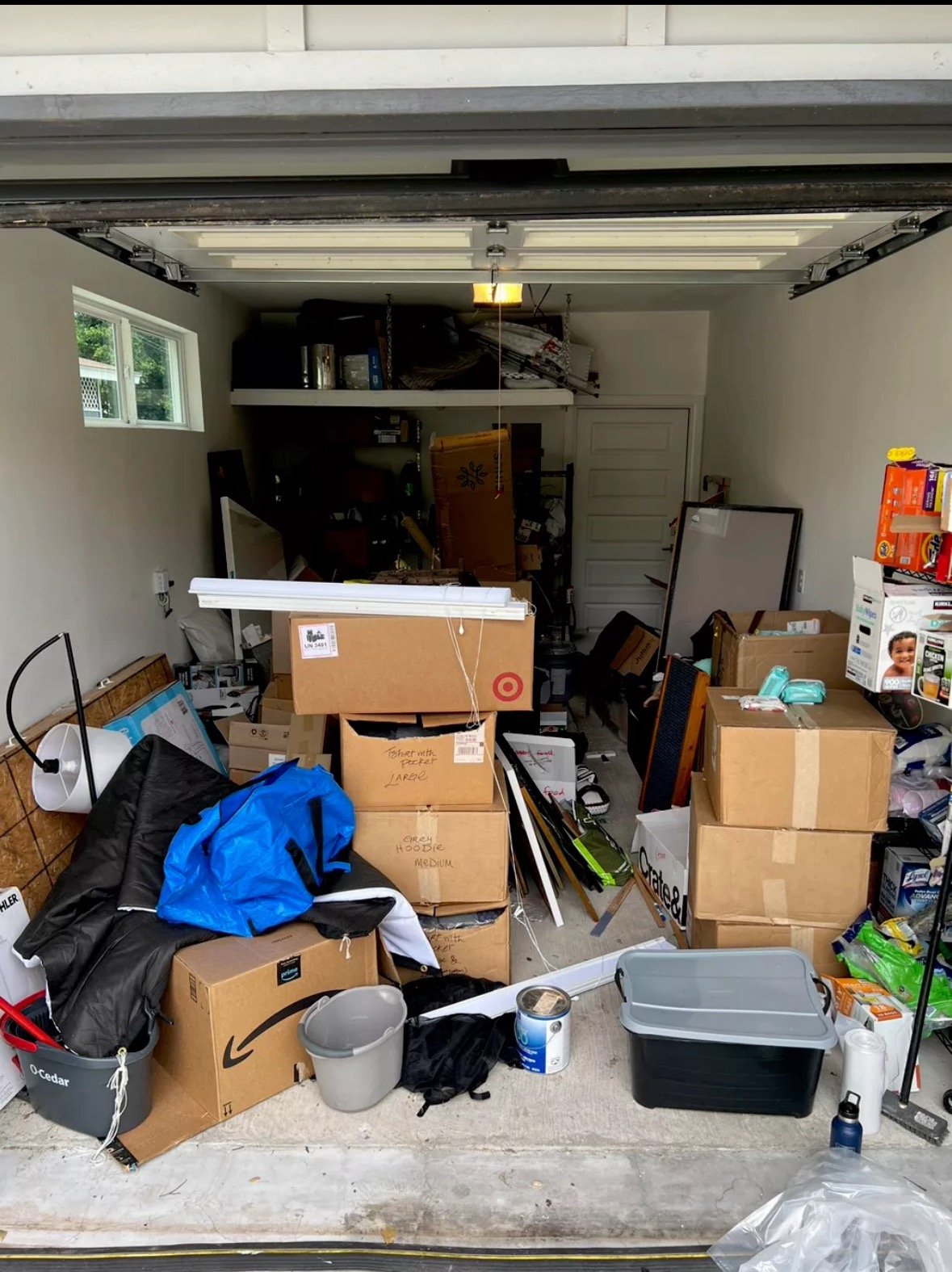 Cluttered garage before Top Tier Tidying organized it